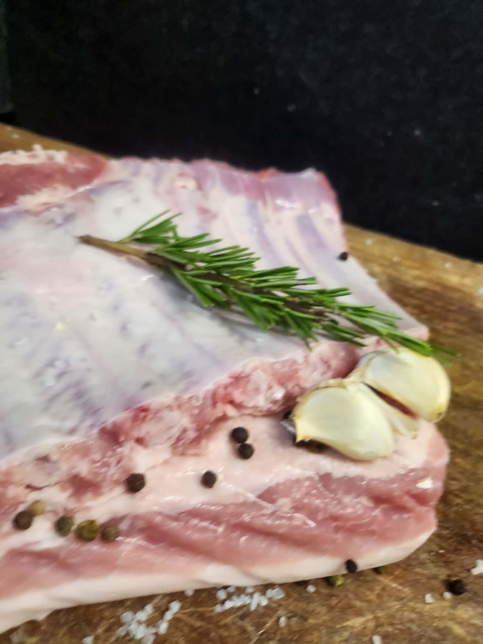 Rack of pork ribs with rosemary, roasted garlic and cracked pepper